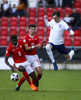 10th May, AESSEAL New York Stadium, Rotherham, England; UEFA Under 17 European Championships, Switzerland versus England; James Garner of England jumps to avoid a tackle from Alexandre Jankewitz of Switzerland and David Jacovic of Switzerland  ActionPlus12023302