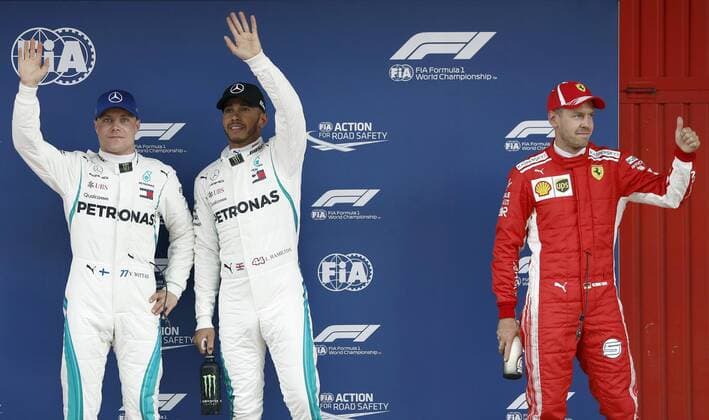 British F-1 driver Lewis Hamilton (C), of Mercedes GP team, celebrates after winning the pole position ahead of his teammate Finnish Valtteri Bottas (L), second, and German Sebastian Vettel, of Ferrari, after the qualifying session for F-1 Spain GP race at Circuito de Barcelona-Cataluna circuit in Montmelo, outside Barcelona, Spain, 12 May 2018. The race will be held on 13 May 2018. Qualifying session for F-1 Spain GP race !ACHTUNG: NUR REDAKTIONELLE NUTZUNG!  Copyright: xAndreuxDalmaux GRAF5596 20180512-636617406476050507