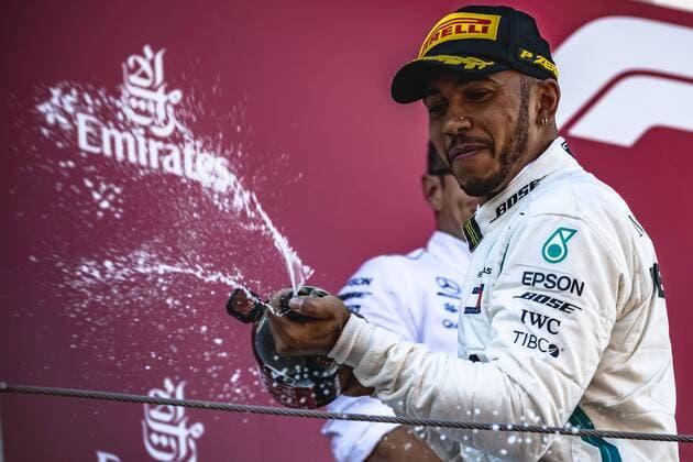 May 13, 2018 - Barcelona, Catalonia, Spain - LEWIS HAMILTON (GBR) of Mercedes sprays with champagne as he celebrates his victory of the Spanish GP holding his cup on the podium at the Circuit de Barcelona - Catalunya F1 2018: Spanish Grand Prix: Hamilton Wins - ZUMAo105 20180513_zap_o105_007 Copyright: xMatthiasxOesterlex