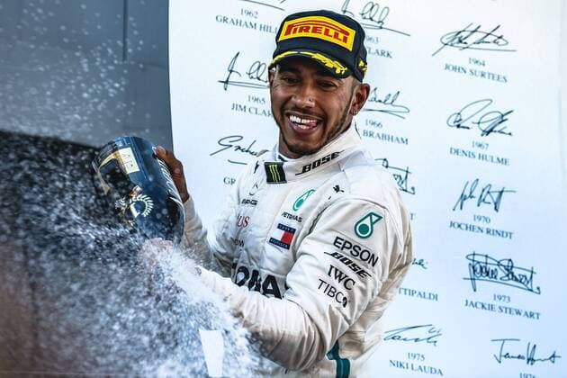 May 13, 2018 - Barcelona, Catalonia, Spain - LEWIS HAMILTON (GBR) of Mercedes sprays with champagne as he celebrates his victory of the Spanish GP holding his cup on the podium at the Circuit de Barcelona - Catalunya F1 2018: Spanish Grand Prix: Hamilton Wins - ZUMAo105 20180513_zap_o105_008 Copyright: xMatthiasxOesterlex