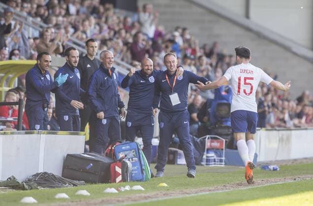 13th May 2018, Pirelli Stadium, Burton-upon-Trent, England; UEFA Under 17 European Championships, quarter final, Norway U17s versus England U17s; Bobby Duncan of England celebrates by running to England Coach Steven Cooper after heading the ball in to the Norway goal in the 14th minute (0-1)  ActionPlus12024740