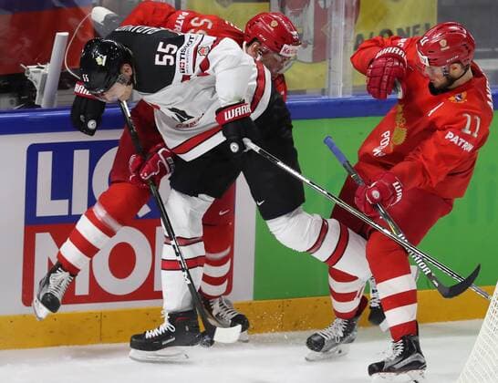 COPENHAGEN, DENMARK - MAY 17, 2018: Canada s Colton Parayko (L front), Russia s Bogdan Kiselevich (L back) and Sergei Andronov (R front) fight for the puck in their 2018 IIHF Ice hockey Eishockey World Championship WM Weltmeisterschaft Quarterfinal match at Royal Arena. Anton Novoderezhkin TASS  TS07FDFB