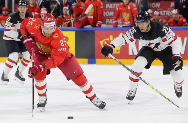 COPENHAGEN, DENMARK - MAY 17, 2018: Russia s Mikhail Grigorenko (front) and Canada s Darnell Nurse (R) fight for the puck in their 2018 IIHF Ice hockey Eishockey World Championship WM Weltmeisterschaft Quarterfinal match at Royal Arena. Alexander Demianchuk TASS  TS07FE18