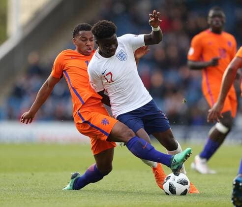 Quinten Maduro of Netherlands tackles Bukayo Saka of England during the Semi Final match at the Proact Stadium, Chesterfield. Picture date 17th May 2018. Picture credit should read: Simon Bellis Sportimage EDITORIAL USE ONLY. No use with unauthorised audio, video, data, fixture lists, club league logos or live services. Online in-match use limited to 120 images, no video emulation. No use in betting, games or single club league player publications.