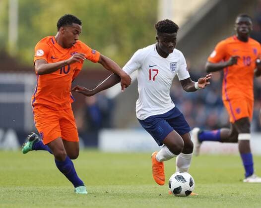 Quinten Maduro of the Netherlands tackles Bukayo Saka of England during the Semi Final match at the Proact Stadium, Chesterfield. Picture date 17th May 2018. Picture credit should read: Simon Bellis Sportimage EDITORIAL USE ONLY. No use with unauthorised audio, video, data, fixture lists, club league logos or live services. Online in-match use limited to 120 images, no video emulation. No use in betting, games or single club league player publications.