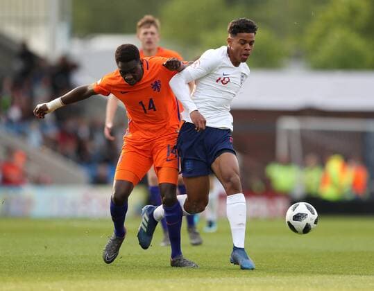 Cristopher Mamengi of the Netherlands tackles Faustino Anjorin of England during the Semi Final match at the Proact Stadium, Chesterfield. Picture date 17th May 2018. Picture credit should read: Simon Bellis Sportimage EDITORIAL USE ONLY. No use with unauthorised audio, video, data, fixture lists, club league logos or live services. Online in-match use limited to 120 images, no video emulation. No use in betting, games or single club league player publications.