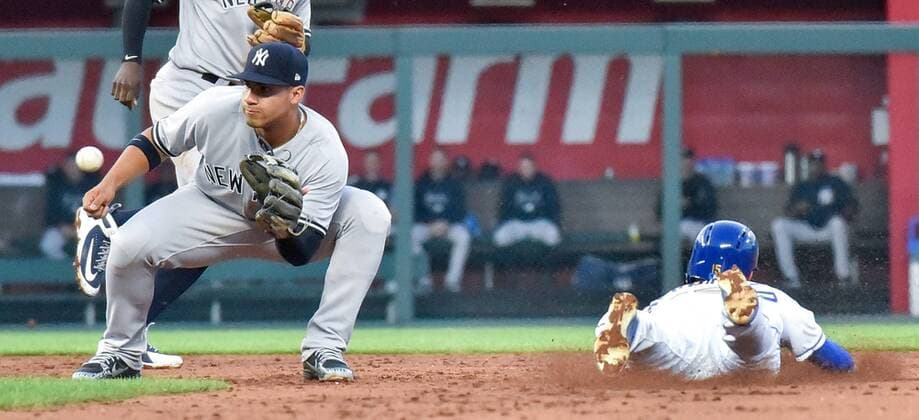 May 18, 2018 - Kansas City, MO, USA - Kansas City Royals Whit Merrifield steals second before the throw to New York Yankees second baseman Gleyber Torres in the third inning during Friday s baseball game on May 18, 2018, at Kauffman Stadium in Kansas City, Mo. Royals vs Yankees - ZUMAm67_ 20180518_zaf_m67_029 Copyright: xJohnxSleezerx