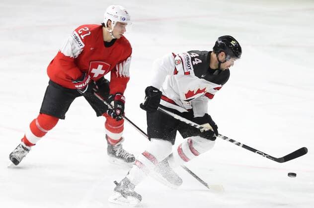 COPENHAGEN, DENMARK - MAY 19, 2018: Switzerlandâ€™s Kevin Fiala (L) and Canadaâ€™s Marc-Edouard Vlasic in their 2018 IIHF World Championship WM Weltmeisterschaft semi-final match at Royal Arena in Copenhagen. Anton Novoderezhkin TASS  TS0802EC