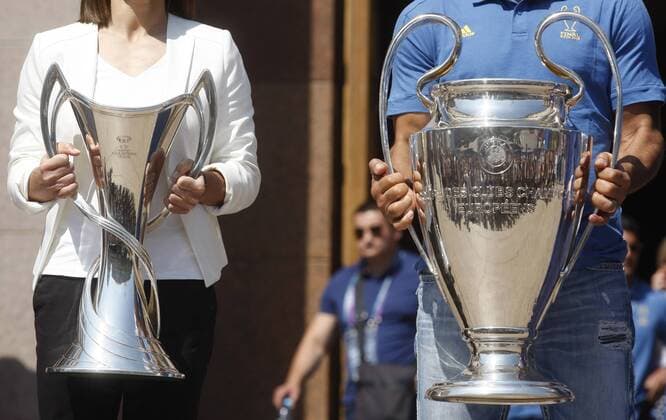 May 24, 2018 - Kiev, Ukraine - CAFU (R), former soccer player of Milan and IYA ANDRUSCHAK (L), Ukrainian national soccer player and ambassador for the UEFA Women s Champions League final, pose with the UEFA Champions League trophies during the opening ceremony of a Champions Festival in Kiev, Ukraine, on 24 May, 2018. Real Madrid will face Liverpool FC in the UEFA Champions League final at the NSC Olimpiyskiy stadium in Kiev on 26 May 2018. Real Madrid vs Liverpool FC - ZUMAg194 20180524_zap_g194_007 Copyright: xSergxGlovnyx