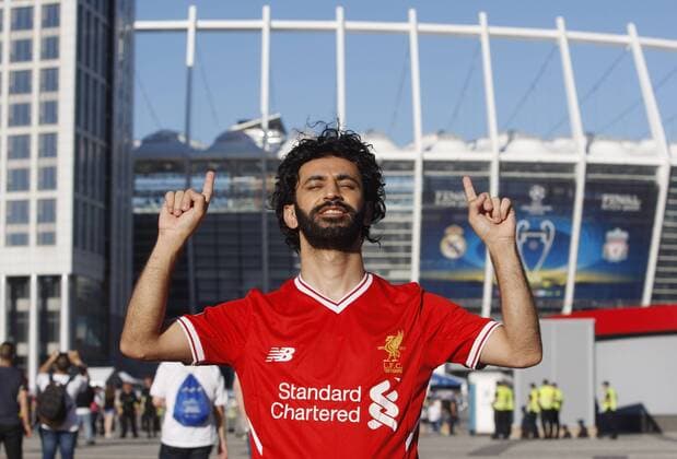 May 26, 2018 - Kiev, Ukraine - A man dressed like Liverpool s Mohamad Salah poses for a photo in front of the NSC Olimpiyskiy stadium in Kiev, Ukraine, 26 May 2018. Real Madrid will face Liverpool FC in the UEFA Champions League final at the NSC Olimpiyskiy stadium on 26 May 2018. Real Madrid vs Liverpool FC, UEFA Champions League final - ZUMAg194 20180526_zap_g194_008 Copyright: xSergxGlovnyx