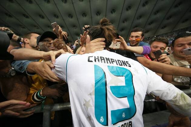 Real Madrid v Liverpool UEFA Champions League Final Gareth Bale of Real Madrid celebrates victory with the Real Madrid fans at the end of the UEFA Champions League Final at the Olympic Stadium, Kiev Content Not Available For UK Newspapers Copyright: xPaulxChestertonx FIL-11844-0072