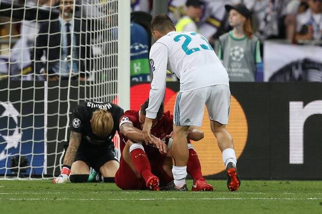 Real Madrid v Liverpool UEFA Champions League Final Mateo Kovacic of Real Madrid tries to goes to console as Loris Karius of Liverpool and Dejan Lovren of Liverpool are distraught at the end of the UEFA Champions League Final at the Olympic Stadium, Kiev Content Not Available For UK Newspapers Copyright: xPaulxChestertonx FIL-11844-0165