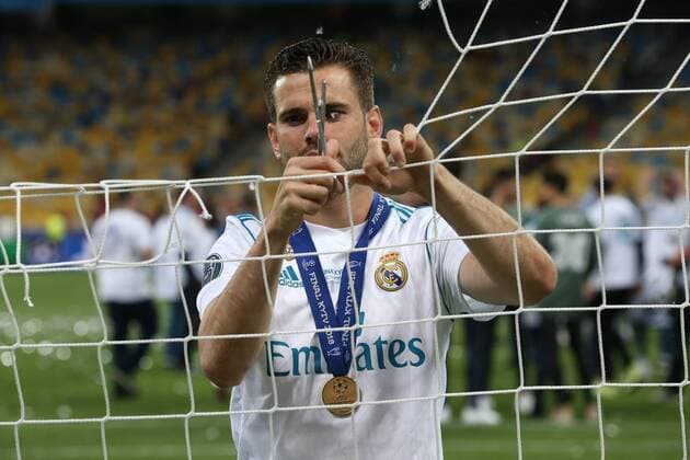 Real Madrid v Liverpool UEFA Champions League Final Nacho Fernandez of Real Madrid cuts the net at the end of the UEFA Champions League Final at the Olympic Stadium, Kiev Content Not Available For UK Newspapers Copyright: xPaulxChestertonx FIL-11844-0214