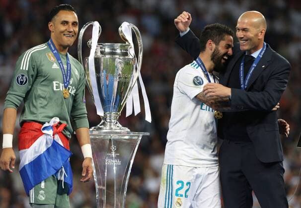 (180527) -- KIEV, May 27, 2018 -- Real Madrid s coach Zidane (R) celebrates with Isco after the UEFA Champions League final match between Liverpool and Real Madrid in Kiev, Ukraine on May 26, 2018. Real Madrid claimed the title with 3-1. ) (SP)UKRAINE-KIEV-CHAMPIONS LEAGUE-LIVERPOOL-REAL MADRID Sergey 