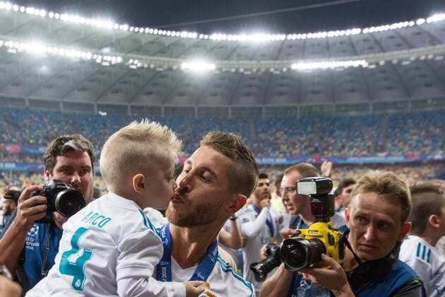 SOCCER - UEFA CL final, Liverpool vs Real KIEV,UKRAINE,26.MAY.18 - SOCCER - UEFA Champions League, final, Liverpool FC vs Real Madrid CF. Image shows Sergio Ramos (Madrid) with kid. GEPAxpictures xMaticxKlansek