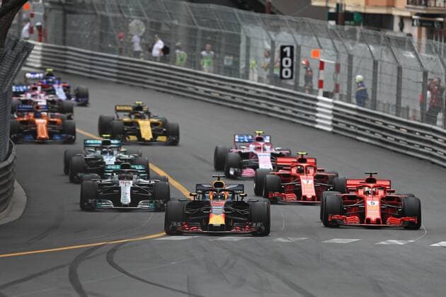 27th May 2018, Circuit de Monaco, Monaco, Monte Carlo; Monaco Formula 1 Grand Prix, race day; Aston Martin Red Bull Racing TAG Heuer, Daniel Ricciardo leads the race start into corner 1 ahead of Vettel  ActionPlus12029685 Octane