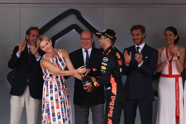 27th May 2018, Circuit de Monaco, Monaco, Monte Carlo; Monaco Formula 1 Grand Prix, race day; Aston Martin Red Bull Racing TAG Heuer, Daniel Ricciardo comes first in Monaco and shares his bottle with the Princess Charlene of Monaco  ActionPlus12029777 Octane
