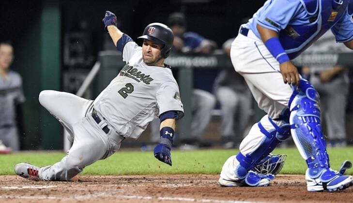 May 28, 2018 - Kansas City, MO, USA - Minnesota Twins Brian Dozier scores behind Kansas City Royals catcher Salvador Perez on a three-run double by Eddie Rosario in the eighth inning during Monday s baseball game on May 28, 2018, at Kauffman Stadium in Kansas City, Mo. Twins vs Royals - ZUMAm67_ 20180528_zaf_m67_030 Copyright: xJohnxSleezerx