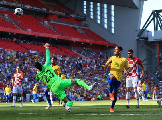 3rd June 2018, Anfield, Liverpool, England; International Football friendly, Brazil versus Croatia; Roberto Firmino of Brazil lobs the ball over Danijel Subasic, Croatia goalkeeper to give his team a 2-0 lead  ActionPlus12032547 DavidxBlunsden