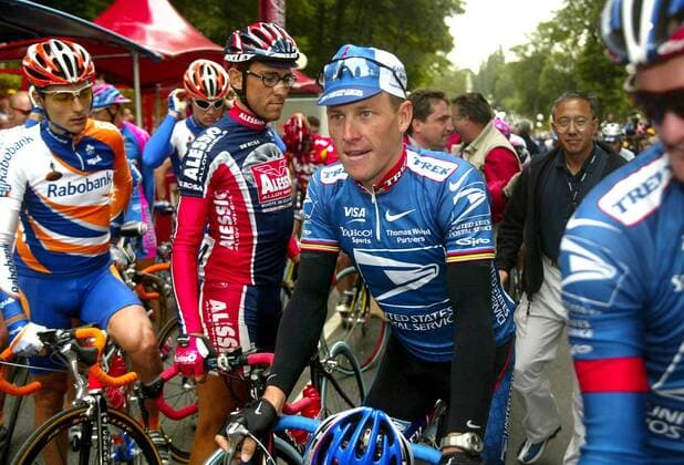 NO MAGS-NO SALES-NO INTERNET BRU69 - - ALENCON, FRANCE : US Lance Armstrong prepares to take the start of the 6th stage of the 89th Tour de France between Forges-les-Eaux and Alençon, 12 July 2002. German Erik Zabel of the Deutsche Telekom won the stage ahead of the Belgian Lotto-Adecco team Australian leader Robbie McEwen and Spanish World Champion of the Mapei cycling team Oscar Freire. REPORTERS - PHILIPPExBUISSIN  x999115x