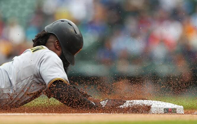Themen der Woche - SPORT KW23 Bilder des Tages - SPORT June 8, 2018 - Chicago, IL, USA - The Pittsburgh Pirates Josh Harrison slides into third base on an Austin Meadows single in the first inning against the Chicago Cubs at Wrigley Field in Chicago on Friday, June 8, 2018. The Cubs won, 3-1. Pittsburgh at Chicago Cubs - ZUMAm67_ 20180608_zaf_m67_012 Copyright: xJohnxJ.xKimx