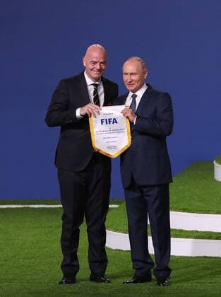(180613) -- MOSCOW, June 13, 2018 -- Russian President Vladimir Putin (R) and FIFA President Gianni Infantino pose for photos during the 68th FIFA Congress in Moscow, Russia, on June 13, 2018. The 68th FIFA Congress opened here on Wednesday, one day before the first match of the 2018 World Cup in Russia kicked off. ) (SP)RUSSIA-MOSCOW-68TH FIFA CONGRESS XuxZijian 