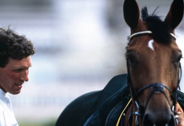 Ludger Beerbaum und Ratina Z Ludger Beerbaum geb.26.08.1963 erhielt mit 8 Jahren ein Pony zum Geschenk aber nachdem das Pferd ihn gebissen hatte erlosch das Interesse des Jungen an dem Pferd aber nach 2 Jahren kam er durch einen Schulfreund und dessen Vater wieder zum Springsport und es stellten sich Erfolge bei Deutschen Meisterschaften der jungen Reiter und der Junioren vor allem aber mit Bronze bei der EM Junge Reiter 1984 ein er wurde dann gefördert von Hermann Schridde und Paul Schockemöhle mit Team-Gold in Seoul 88 wurde Beerbaum dann allgemein bekannt der Erfolg wurde 4 Jahre später bereits mit Olympia-Gold in der Einzelwertung übertroffen dort errang RATINA Z unter Piet Raymakers Einzel-Silber + Team-Gold ein Mäzen ermöglichte im Herbst 1992 daß Beerbaum fortan Ratina Z reiten konnte sodaß Ratina in Atlanta 96l unter Beerbaum Gold erringen konnte Die Erfolge von Beerbaum sind in Team oder Einzel bei Olympiaden Gold 92 + 96 + 2000 + Bronze 88 + 2016 sowie bei WMs Gold in 94 + 98 und Silber in 90 und Bronze in 2006 sowie bei EMs Gold in 97 + 97b+ 99 + 2001 + 2003 + 2911 und Silber in 2003 + 2007 + 2013 sowie Bronze in 2001 + 2007 RATINA Z wird in Aachen durch eine Ratina Z-Allee geehrt für seine Olympiasiege unter 2 verschiedenen Reitern und den Sieg im Großen Preis von Aachen 1996 und den Weltcupsieg 1993 und die Wahl zum Pferd des Jahres 1997 und weitere hervorragende Darbietungen *** Ludger Beerbaum and Ratina Z Ludger Beerbaum born 26 08 1963 received a pony as a gift at the age of 8 but after the horse had bitten him the boys interest in the horse disappeared but after 2 years he came back to show jumping and his father through a school friend and his father successes in German Championships of young riders and juniors but above all with bronze at the EM Young Rider 1984 he was then sponsored by Hermann Schridde and Paul Schockemöhle with Team Gold in Seoul 88 Beerbaum then became well known the success was 4 RATINA Z under Piet Raymakers singles silver team gold won a patron in the autumn of 1992 that Beerbaum could now ride Ratina Z so that Ratina could win gold in Atlanta 96l under Beerbaum Gold The successes of Beerbaum are in Team or individual at Olympiads Gold 92 96 2000 Bronze 88 2016 as well as at World Championships Gold in 94 98 and Silver in 90 and Bronze in 2006 as well as EMs Gold in 97 97b 99 2001 2003 2911 and Silver in 2003 2007 2013 and Bronze in 2001 2007 RATINA Z is honored in Aachen by a Ratina Z Allee for his Olympic victory under 2 different riders and the victory in the Grand Prix of Aachen in 1996 and the World Cup victory in 1993 and the horse of the year 1997 and other outstanding performances