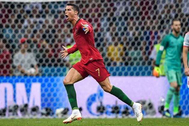 Cristiano Ronaldo of Portugal celebrates after scoring a goal against Spain by a free kick in their Group B match during the FIFA World Cup WM Weltmeisterschaft Fussball 2018 in Sochi, Russia, 15 June 2018. Cristiano Ronaldo nets hat trick to steal a draw against Spain  20180616_08991