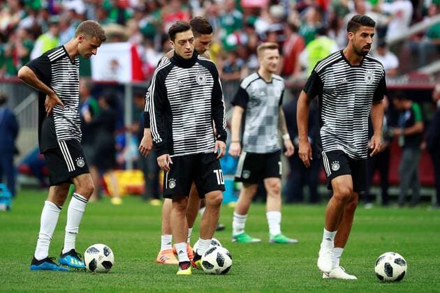 (L-R) German forward Thomas Muller, German midfielder Mesut Ozil, and German midfielder Sami Khedira, warm up prior to the FIFA World Cup WM Weltmeisterschaft Fussball 2018 Group F soccer match between Germany and Mexico, in Moscow, Russia, 17 June 2018. GERMANY VS. MEXICO !ACHTUNG: NUR REDAKTIONELLE NUTZUNG!  Copyright: xJosexMendezx FWC09-54 20180617-636648504064249662