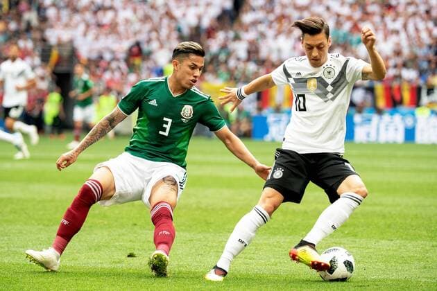 180617 Carlos Salcedo of Mexico and Mesut Özil of Germany during the FIFA World Cup WM Weltmeisterschaft Fussball group stage match between Germany and Mexico on June 17, 2018 in Moscow. Photo: Petter Arvidson BILDBYRAN kod PA 92069 Copyright: PETTERxARVIDSON BB180617PA049