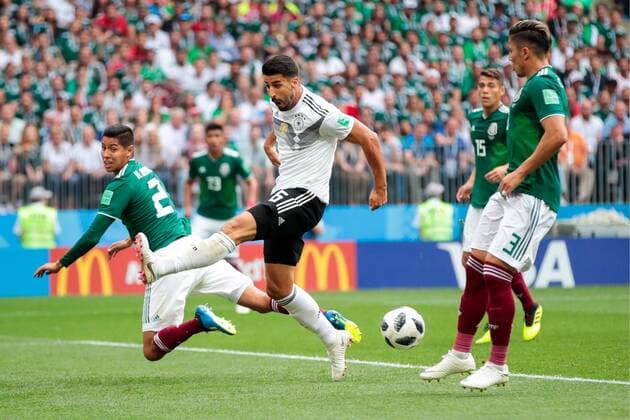 MOSCOW, RUSSIA - JUNE 17, 2018: Mexico s Hugo Ayala, Germany s Sami Khedira, and Mexico s Carlos Salcedo (L-R) fight for the ball in their 2018 FIFA World Cup WM Weltmeisterschaft Fussball Group F football match at Luzhniki Stadium. Denis Tyrin TASS  TS084C3C