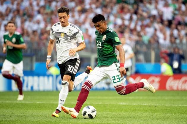 180617 Mesut Özil of Germany and Jesus Gallardo of Mexico during the FIFA World Cup WM Weltmeisterschaft Fussball group stage match between Germany and Mexico on June 17, 2018 in Moscow. Photo: Petter Arvidson BILDBYRAN kod PA 92069 Copyright: PETTERxARVIDSON BB180617PA071