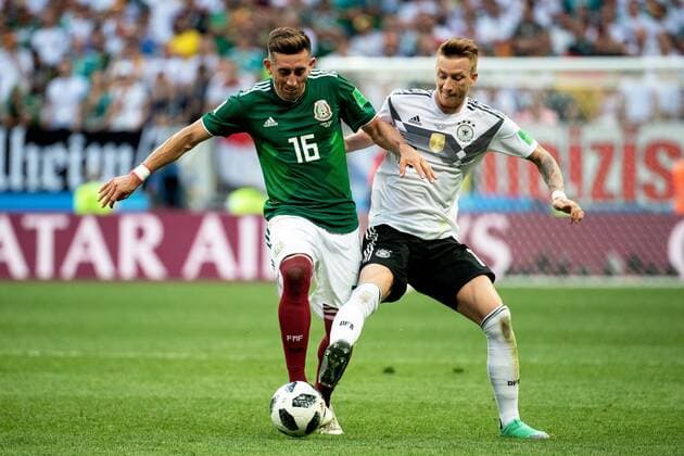 180617 Hector Herrera of Mexico and Marco Reus of Germany during the FIFA World Cup WM Weltmeisterschaft Fussball group stage match between Germany and Mexico on June 17, 2018 in Moscow. Photo: Petter Arvidson BILDBYRAN kod PA 92069 Copyright: PETTERxARVIDSON BB180617PA073