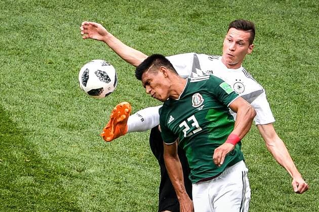 Jesus Gallardo of Mexico, front, heads the ball against Germany in their Group F match during the 2018 FIFA World Cup WM Weltmeisterschaft Fussball in Moscow, Russia, 17 June 2018. In one of the more highly-anticipated matches of the World Cup s group stage, Mexico went ahead in the 35th minute against defending champion Germany on a goal from Hirving Lozano. The Mexicans were on the front foot for most of the first half and were consistently threatening on the counter-attack. Javier Hernandez found himself up against Germany defender Jerome Boateng, and had Lozano open on his left. Hernandez threaded the ball through and all it took was one cutback on Mesut Ozil in the penalty area for Lozano to get some space and tuck one away on the near post, beating Germany goalkeeper Manuel Neuer. Mexico hangs on to stun defending champion Germany  20180617_90491