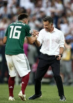 MOSCOW, RUSSIA - JUNE 17, 2018: Mexico s Hector Herrera (L) and head coach Juan Carlos Osorio celebrate their victory in the 2018 FIFA World Cup WM Weltmeisterschaft Fussball Group F football match against Germany at Luzhniki Stadium. Mexico won the game 1-0. Valery Sharifulin TASS  TS084CA5