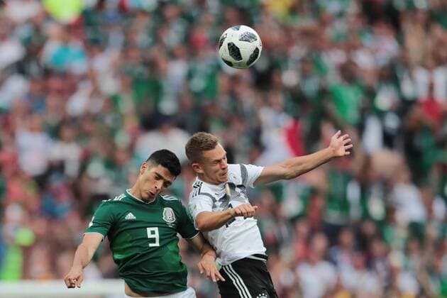 KAZAN, RUSSIA - JUNE 17: forward Raul Jimenez of Mexico and defender Joshua Kimmich of Germany during a Group F 2018 FIFA World Cup WM Weltmeisterschaft Fussball soccer match between Germany and Mexico on June 16, 2018, at Kazan Arena in Kazan, Russia. (Photo by Anatoliy Medved Icon Sportswire) SOCCER: JUN 17 FIFA World Cup Group Stage - Germany v Mexico Icon180617038 EDITORIAL USE ONLY