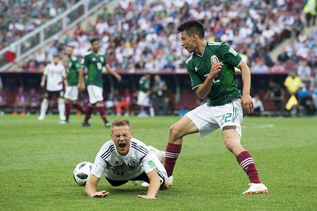 June 17, 2018 - Moscow, Russia - Joshua Kimmich of Germany fouled by Hirving Lozano of Mexico during the 2018 FIFA World Cup WM Weltmeisterschaft Fussball Russia Group F match between Germany and Mexico at Luzhniki Stadium in Moscow, Russia on June 17, 2018 Germany v Mexico : Group F - 2018 FIFA World Cup Russia  - ZUMAn230 20180617_zaa_n230_1053 Copyright: xAndrewxSurmax