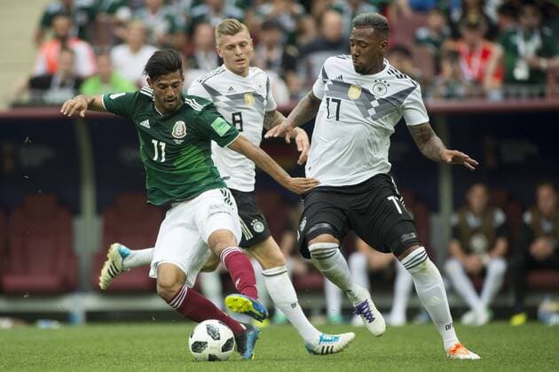June 17, 2018 - Moscow, Russia - Carlos Vela of Mexico and Jerome Boateng of Germany during the 2018 FIFA World Cup WM Weltmeisterschaft Fussball Russia Group F match between Germany and Mexico at Luzhniki Stadium in Moscow, Russia on June 17, 2018 Germany v Mexico : Group F - 2018 FIFA World Cup Russia  - ZUMAn230 20180617_zaa_n230_1067 Copyright: xAndrewxSurmax