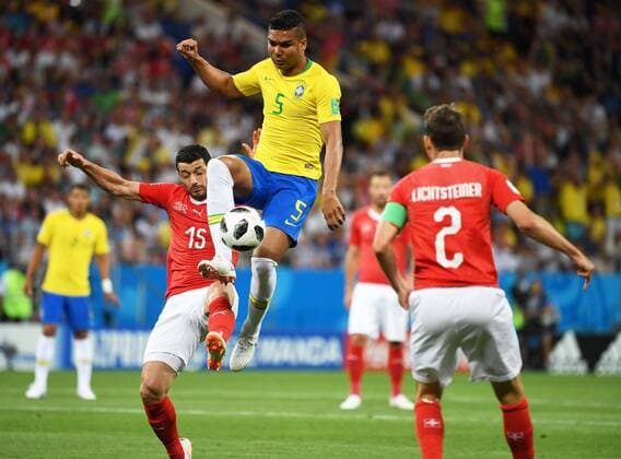 Casemiro of Brazil, center, challenges Stephan Lichtsteiner and Blerim Dzemaili of Switzerland in their Group E match during the 2018 FIFA World Cup WM Weltmeisterschaft Fussball in Rostov, Russia, 17 June 2018. Brazil joined the host of big guns who have failed to fire in their opening World Cup game as lax defending from a corner allowed Switzerland to cancel out Philippe Coutinho s spectacular curling strike and grab a 1-1 draw. The five-times world champions took a deserved lead midway through the first half in the Group E game when Coutinho s irresistible long-distance shot cannoned in off the far post, but Tite s side, who had looked so impressive in the tournament build-up, failed to build on their advantage. Brazil draw with Switzerland as Coutinho scores spectacular goal  20180618_85079