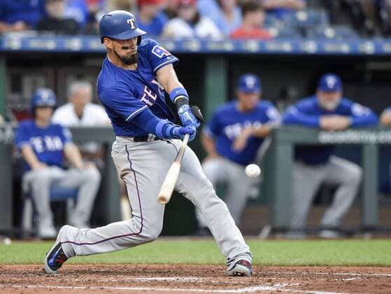 June 19, 2018 - Kansas City, MO, USA - The Texas Rangers Robinson Chirinos connects on a ground ball that turned into a fielding error by Kansas City Royals third baseman Mike Moustakas to score Jurickson Profar in the third inning at Kauffman Stadium in Kansas City, Mo., on Tuesday, June 19, 2018. Texas at Kansas City - ZUMAm67_ 20180619_zaf_m67_029 Copyright: xJohnxSleezerx