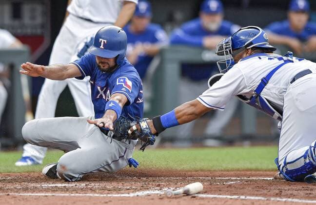 June 19, 2018 - Kansas City, MO, USA - Kansas City Royals catcher Salvador Perez tags out the Texas Rangers Isiah Kiner-Falefa at the plate in the third inning at Kauffman Stadium in Kansas City, Mo., on Tuesday, June 19, 2018. Texas at Kansas City - ZUMAm67_ 20180619_zaf_m67_032 Copyright: xJohnxSleezerx