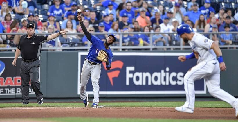 June 20, 2018 - Kansas City, MO, USA - Texas Rangers third baseman Jurickson Profar throws past Kansas City Royals Alex Gordon on a ground ball out on Hunter Dozier to end the fourth inning on Wednesday, June 20, 2018, at Kauffman Stadium in Kansas City, Mo. Texas Rangers vs. Kansas City Royals - ZUMAm67_ 20180620_zaf_m67_070 Copyright: xJohnxSleezerx