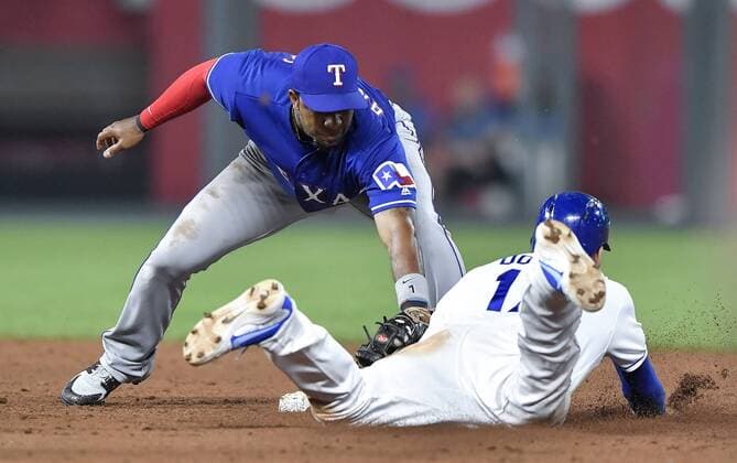 June 20, 2018 - Kansas City, MO, USA - Texas Rangers shortstop Elvis Andrus tags out Kansas City Royals Hunter Dozier trying to steal second to end the ninth inning and the game on Wednesday, June 20, 2018, at Kauffman Stadium in Kansas City, Mo. Texas Rangers vs. Kansas City Royals - ZUMAm67_ 20180620_zaf_m67_077 Copyright: xJohnxSleezerx