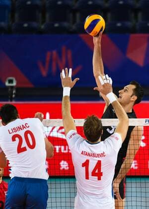 (180622) -- JIANGMEN, June 22, 2018 -- Jason Derocco (R) of Canada spikes the ball during a match against Serbia at the FIVB Nations League 2018 men s tournament in Jiangmen, south China s Guangdong Province, June 22, 2018. Serbia won 3-0. ) (SP)CHINA-JIANGMEN-VOLLEYBALL-FIVB NATIONS LEAGUE-MEN (CN) DengxHua 