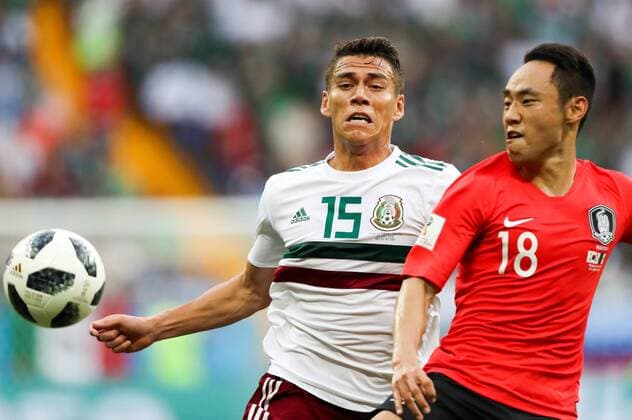 WM 2018, SÃ¼dkorea - Mexiko ROSTOV-ON-DON, RUSSIA â€“ JUNE 23, 2018: Mexico s Hector Moreno (L) and South Korea s Moon Seon-min in action in their 2018 FIFA World Cup WM Weltmeisterschaft Fussball Group F football match at Rostov Arena Stadium. Team Mexico won the game 2:1.Sergei Savostyanov TASS  TS085EDF