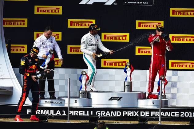 24th June 2018, Circuit Paul Ricard, Le Castellet, France; French Formula One Grand Prix, race day; (L-R) Max Verstappen of the Red Bull Racing Team 3rd place , Lewis Hamilton of the Mercedes AMG F1 Team 1st place and Kimi Raikkonen of the Ferrari Team 3rd place celebrate on the podium after the race  ActionPlus12040318 PabloxGuillen