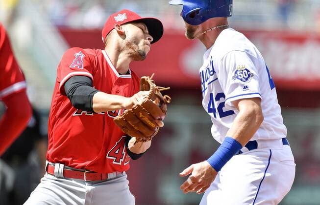 June 25, 2018 - Kansas City, MO, USA - Los Angeles Angels shortstop Andrelton Simmons tags out Kansas City Royals Hunter Dozier on a rundown to end the first inning during Monday s baseball game on June 25, 2018, at Kauffman Stadium in Kansas City, Mo. Angels vs Royals - ZUMAm67_ 20180625_zaf_m67_011 Copyright: xJohnxSleezerx