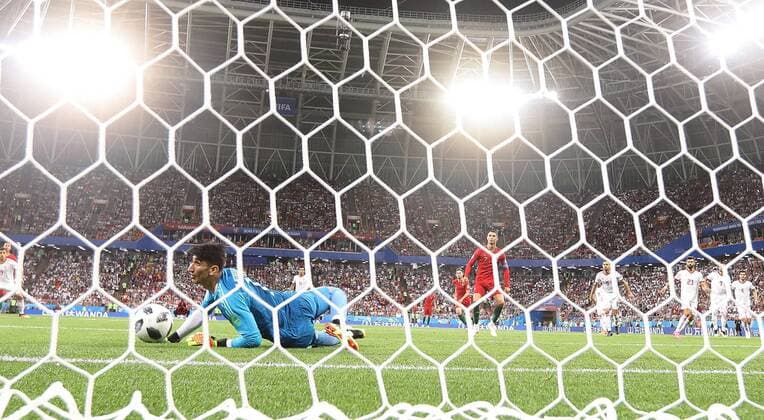 (180625) -- SARANSK, June 25, 2018 -- Iran s goalkeeper Alireza Beiranvand blocks a penalty kick of Cristiano Ronaldo of Portugal during the 2018 FIFA World Cup WM Weltmeisterschaft Fussball Group B match between Iran and Portugal in Saransk, Russia, June 25, 2018. The match ended in a 1-1 draw. Portugal advanced to the round of 16. ) (SP)RUSSIA-SARANSK-2018 WORLD CUP-GROUP B-IRAN VS PORTUGAL FeixMaohua 