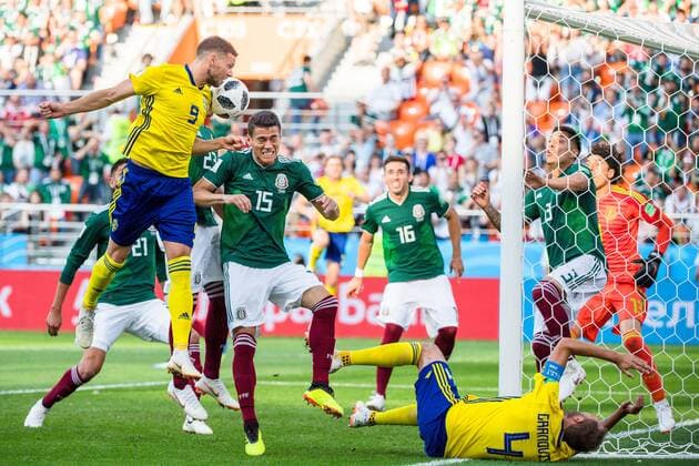 180627 Marcus Berg and Andreas Granqvist against Hector Moreno of Mexico during the FIFA World Cup WM Weltmeisterschaft Fussball group stage match between Mexico and Sweden on June 27, 2018 in Ekaterinburg. Photo: Joel Marklund BILDBYRN kod JM 87737 Copyright: JOELxMARKLUND BB180627JM045