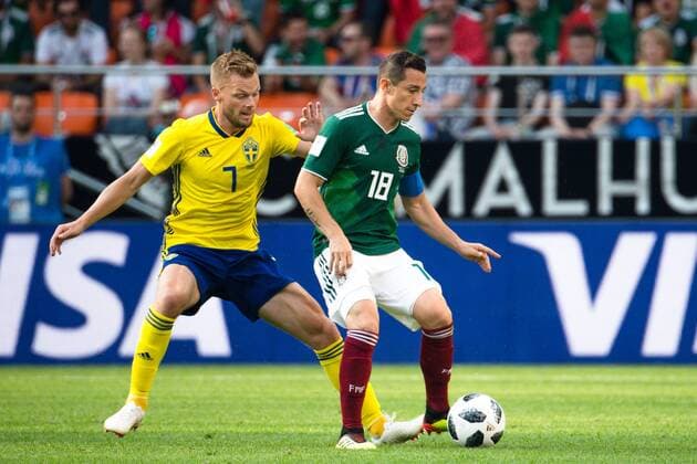 180627 Sebastian Larsson of Sweden and Andres Guardado of Mexico during the FIFA World Cup WM Weltmeisterschaft Fussball group stage match between Mexico and Sweden on June 27, 2018 in Ekaterinburg. Photo: Petter Arvidson BILDBYRN kod PA 87737 Copyright: PETTERxARVIDSON BB180627PA059
